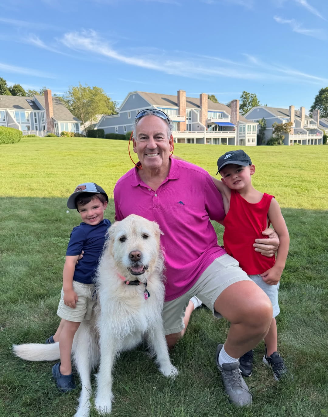 David Singer with family and their dog outdoors